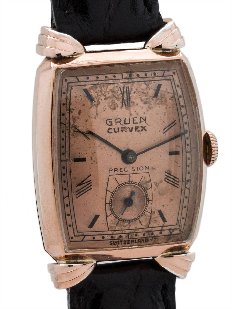 
Man’s vintage PGF Gruen Veri-Thin manual wind dress model circa 1940’s. Featuring a medium size 23 x 34mm tonneau shaped case with fluted angled lugs and with original patina’d original salmon dial with black printed Roman numerals and thin black