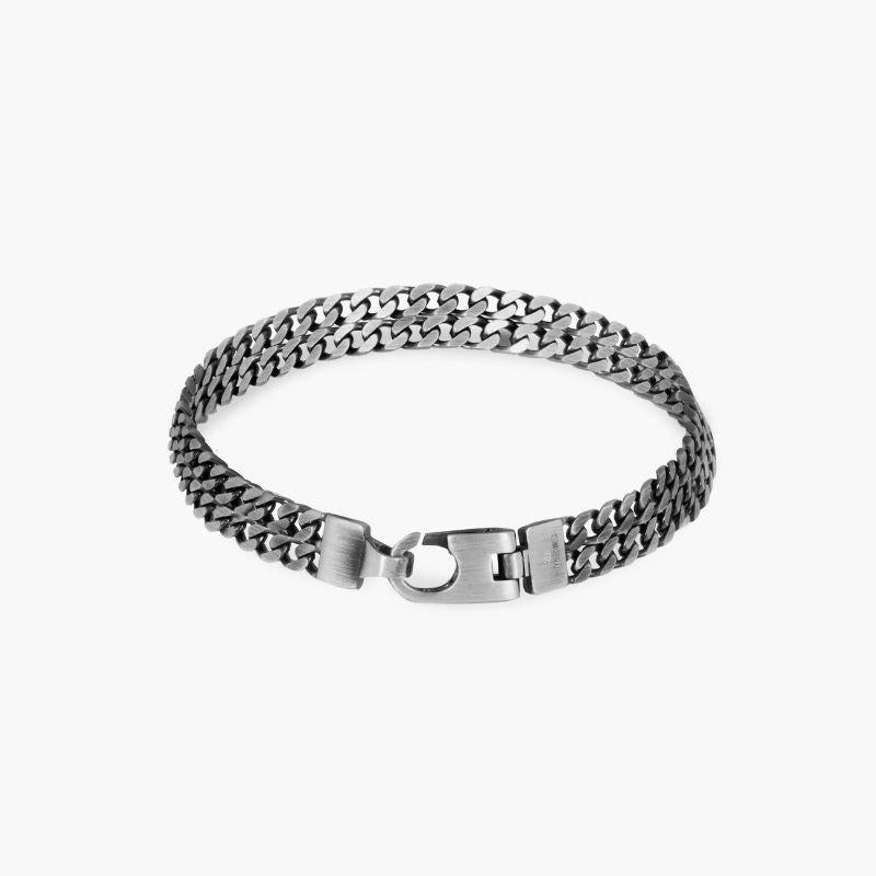 Grumette Silm Bracelet in Oxidised Sterling Silver, Size L

Two slim curb chains run perfectly parallel, creating the illusion of two single bracelets stacked together. Finished with our lobster clasp in antique black rhodium plated sterling silver,