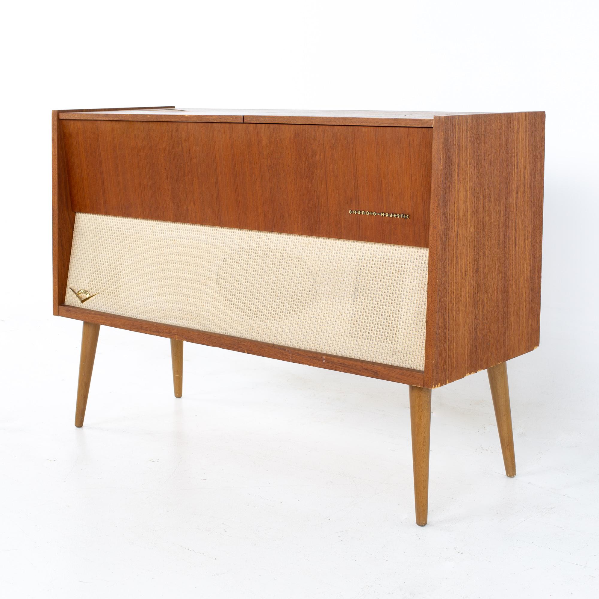Grundig majestic mid century stereo record console.
Stereo measures: 40 wide x 15 deep x 28.5 inches high

All pieces of furniture can be had in what we call restored vintage condition. That means the piece is restored upon purchase so it’s free