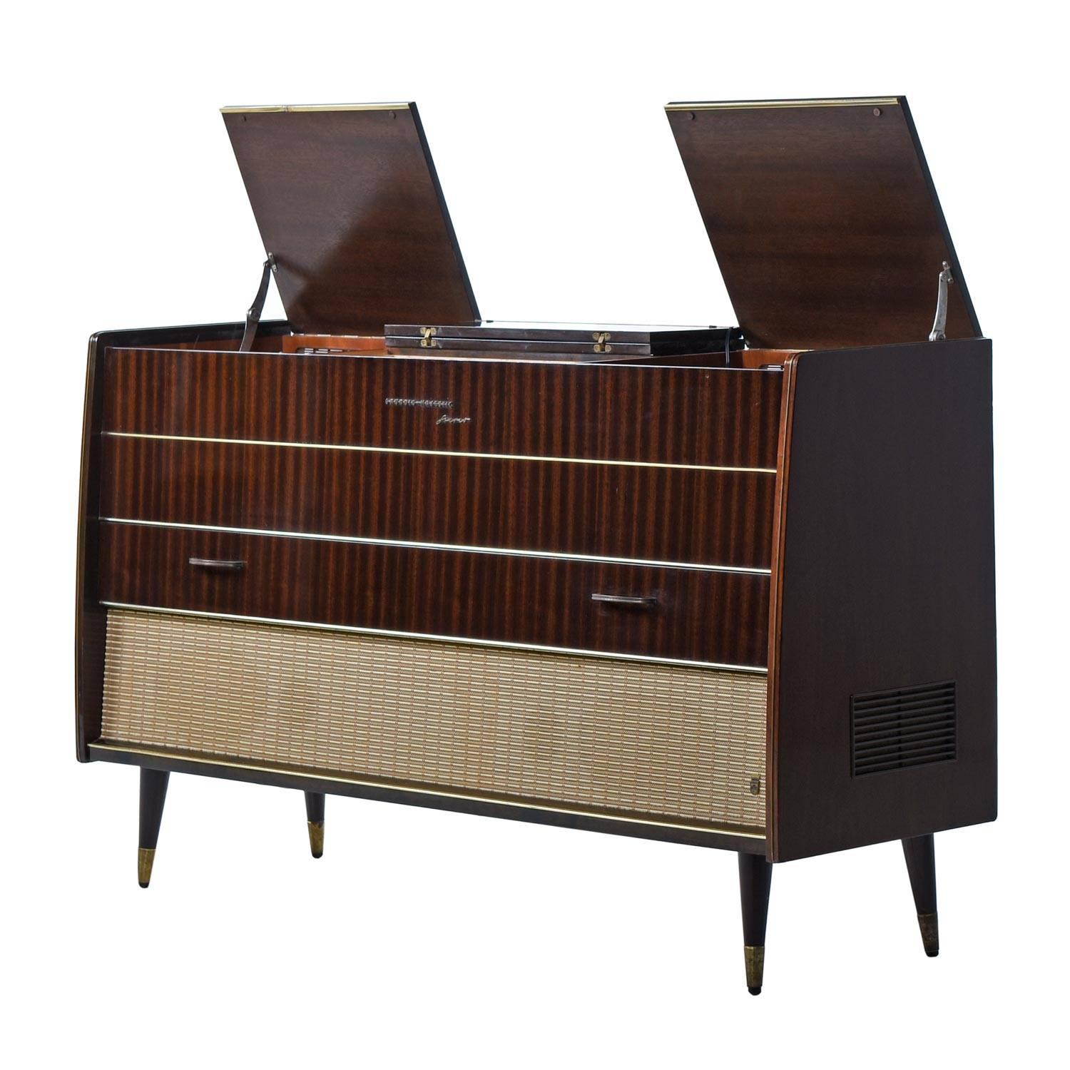 Not only does this 1950s German modern style cabinet look beautiful, but the combination of original and new components sound absolutely amazing. Audiophiles and casual listeners will both appreciate the presence and warm sounds recreated by the
