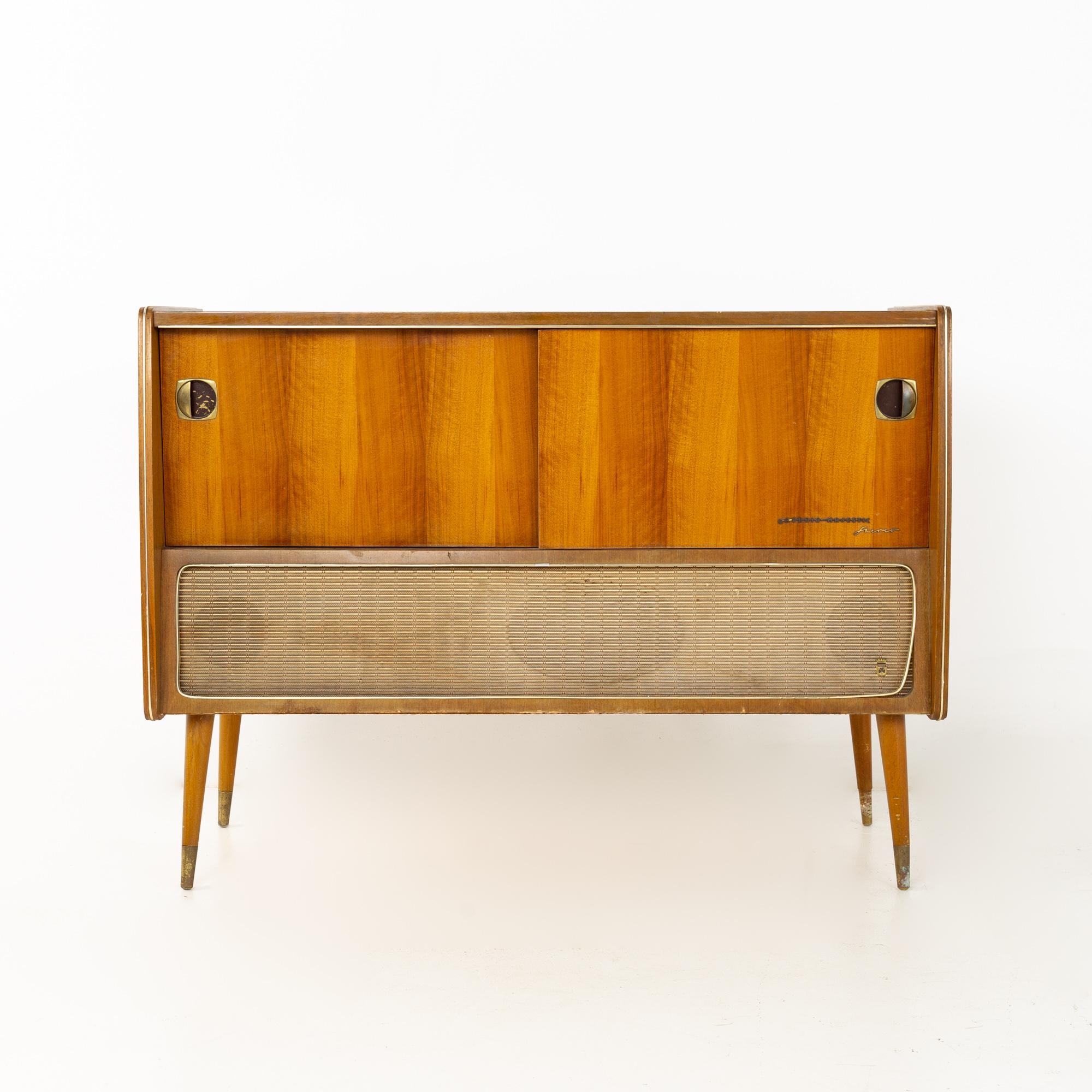 Grundig mid century stereo record console
This console is 44.5 wide x 17 deep x 33 inches high

All pieces of furniture can be had in what we call restored vintage condition. That means the piece is restored upon purchase so it’s free of