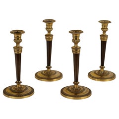 Group of Four Empire Candlesticks Attributed Ravrio Paris Early 19th Century
