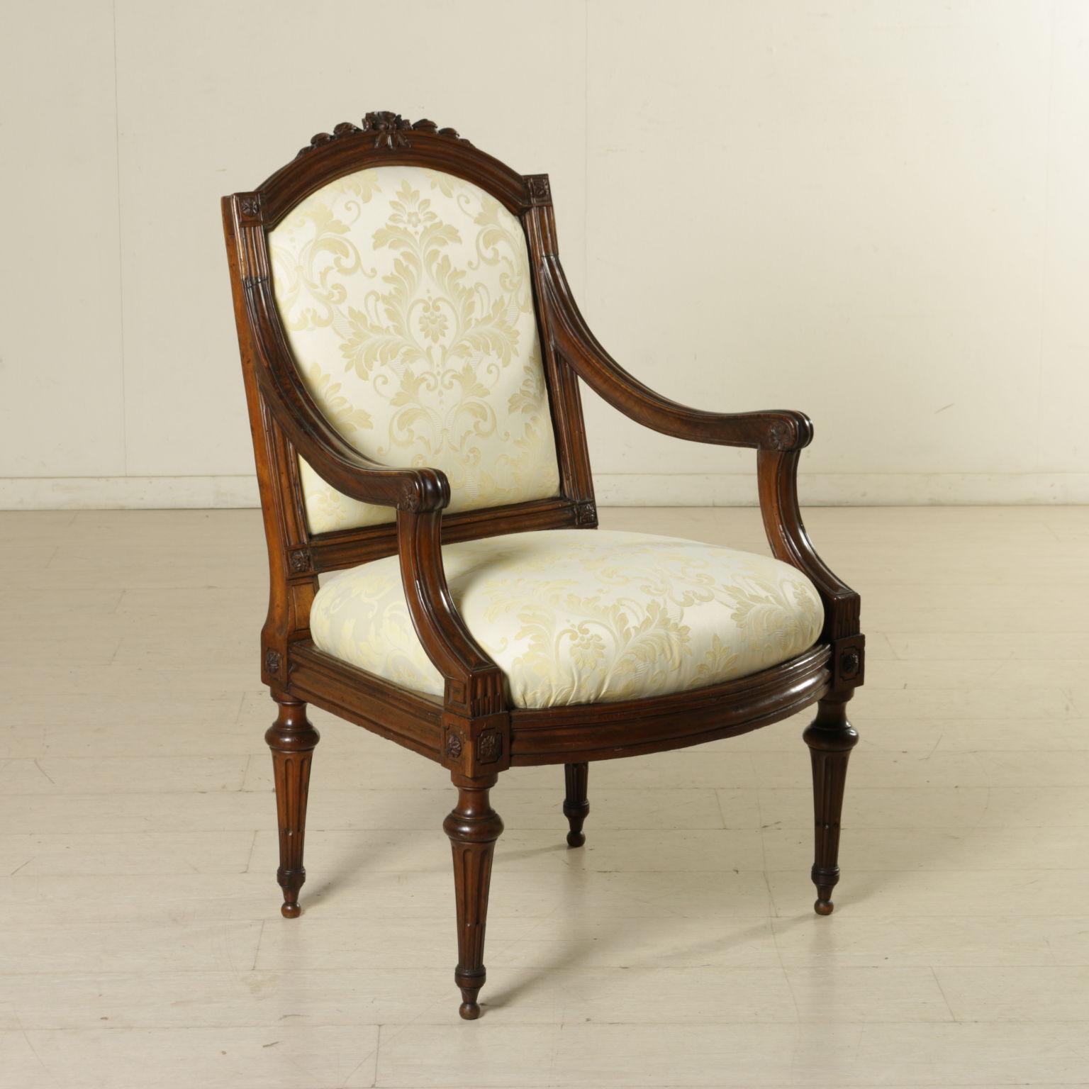 Group of six elegant armchairs held up by truncated conical rudent feet, as well as the upright attachment. Shaped open arms, carved flowers in the bunches, armrests and backrest. Shaped back with carved selvage. They present different padding.