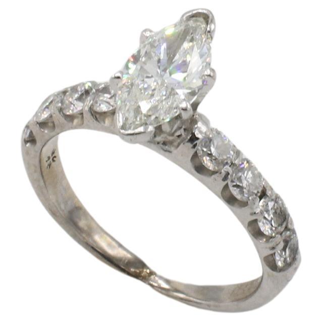 GSI Certified 1.00 Carat H SI2 Marquise Natural Diamond Engagement Ring
Diamond: 1.00 H SI2 natural marquise diamond
Accent diamonds: Approx. 0.32 CTW F-G VS natural round diamonds
Metal: 14k white gold
Weight: 3.72 grams
Height: 7mm
Size: 6
