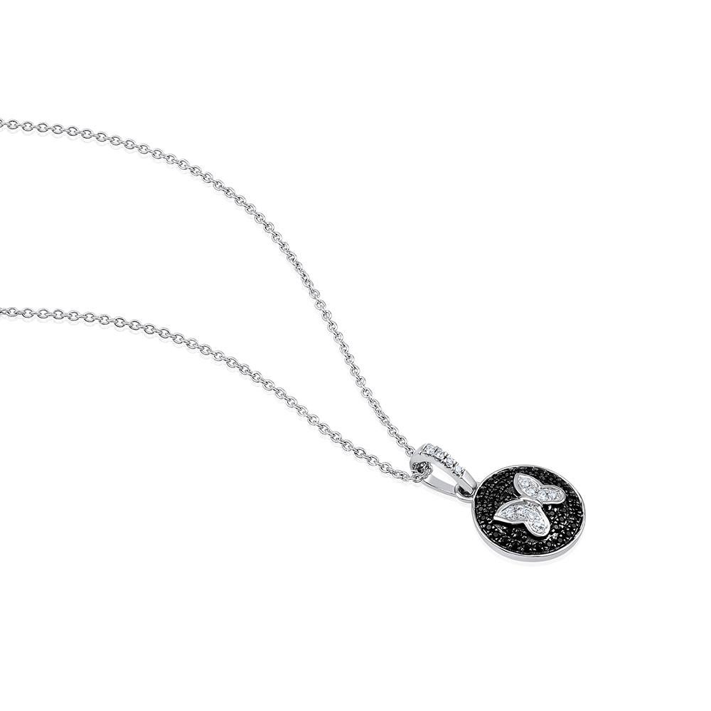 Crafted in 3.64 grams of 14-karat White Gold, contains 12 Stones of Round Diamonds with a total of 0.07-Carats in F-G Color and VS-SI Clarity combined with 40 stones of Black CZ with a total of 0.27 carats. The Necklace is 18-inch in Length.
