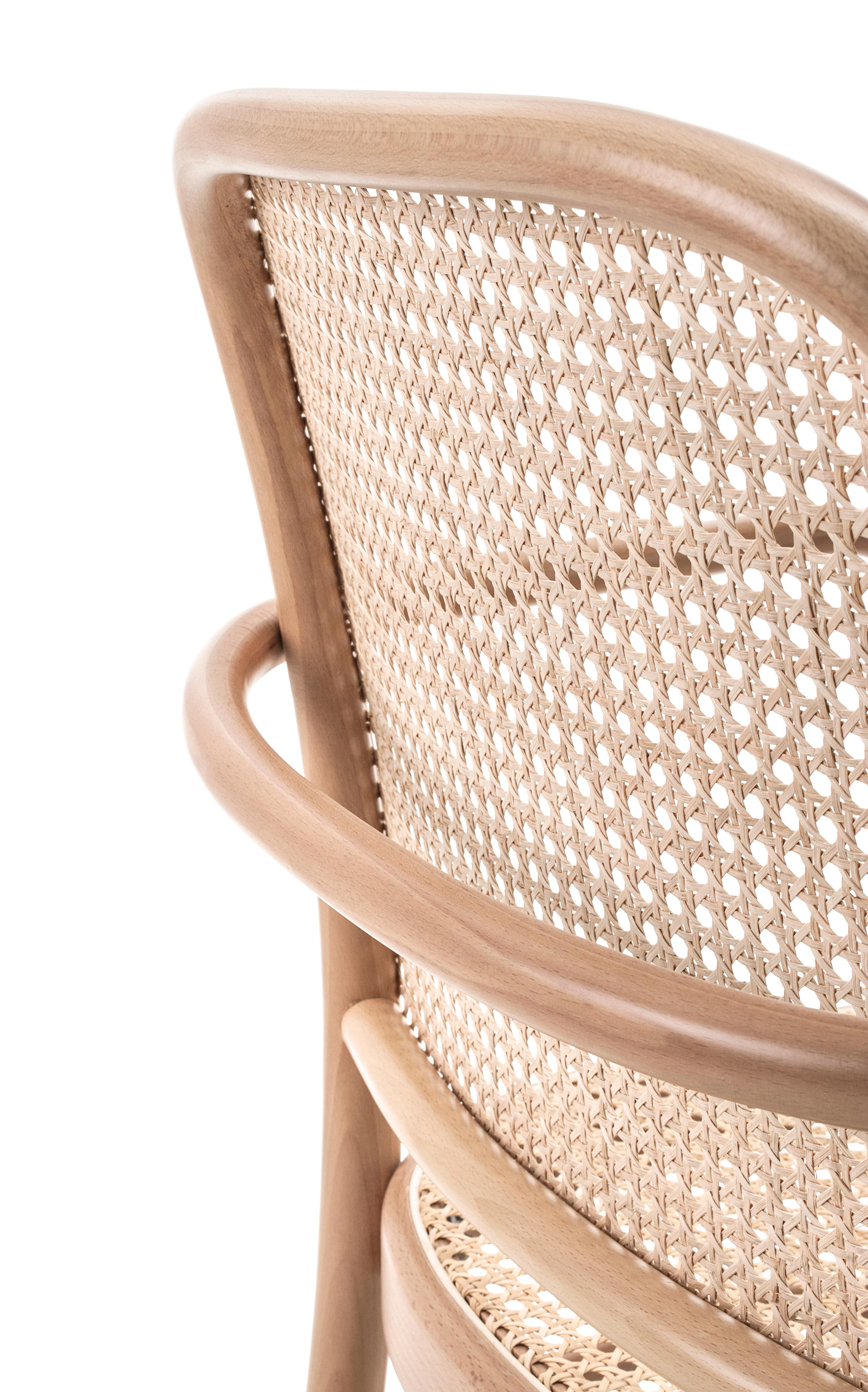 Bent-beech wood chair and armchair designed by Josef Hoffmann in 1930. A timeless and modern design gives the chair N. 811 an outstanding comfort and lightness. Available in three versions: woven cane seat and backrest, upholstered seat and woven