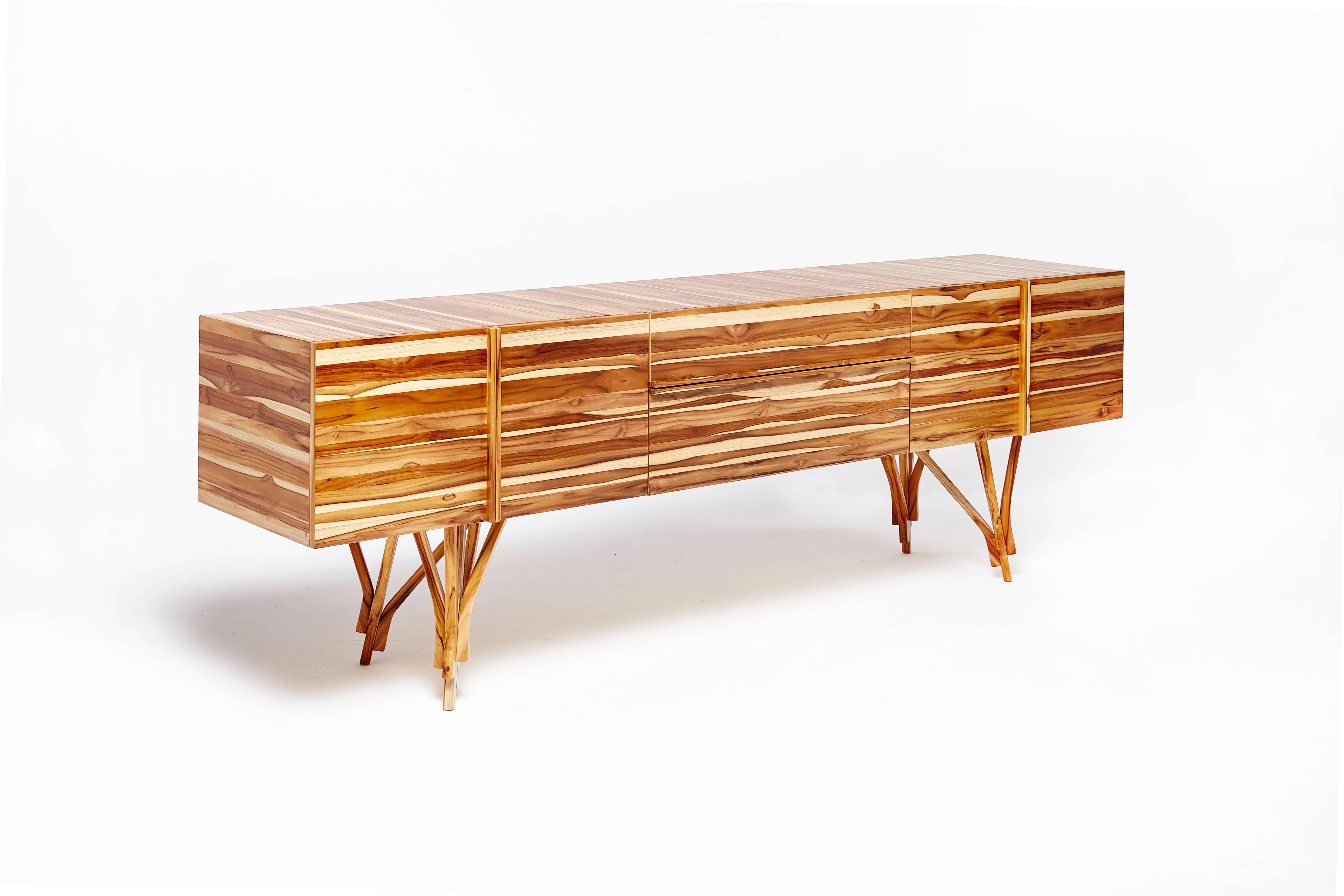 Guaimbê Credenza by Paulo Alves

Body in teak solid wood panel and legs in solid teak. Interior and back in jequitibá wood veneer.

(Six doors and two drawers ) back in same wood veneer 

Dimensions: 240 x 50 x 75 cm. Weight 250 kg.
