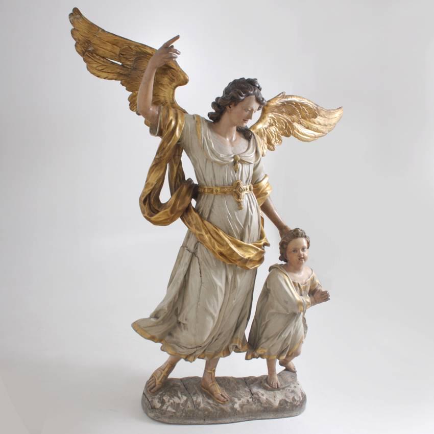 Sculpture grandeur nature d'un ange gardien avec un petit enfant:: attribuée à Matthias Faller (1707 Neukirsch/Schwarzwald - 1791 St. Märgen). Bois sculpté:: partiellement culotté et peint.