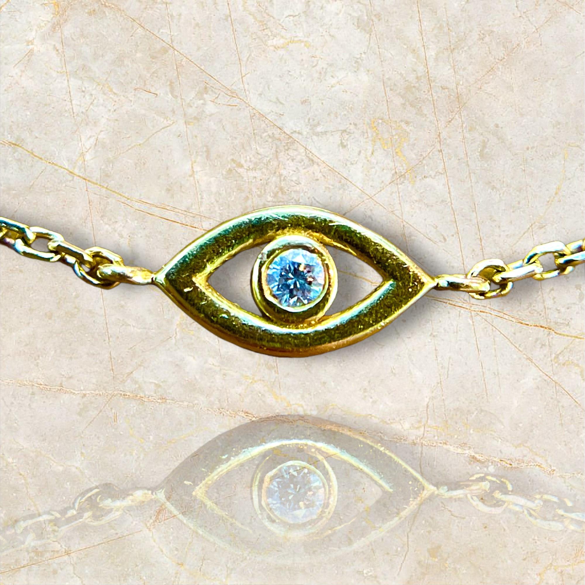 Embrace the charm of this 14K yellow gold evil eye bracelet, adorned with a delicate diamond. The shimmering diamond accentuates the iconic protective symbol, making this bracelet a stylish and meaningful accessory that blends tradition with