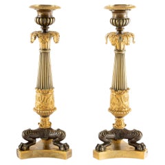 Guardians of the Flame: Pair of Early 19th C Gilt Bronze French Candlesticks