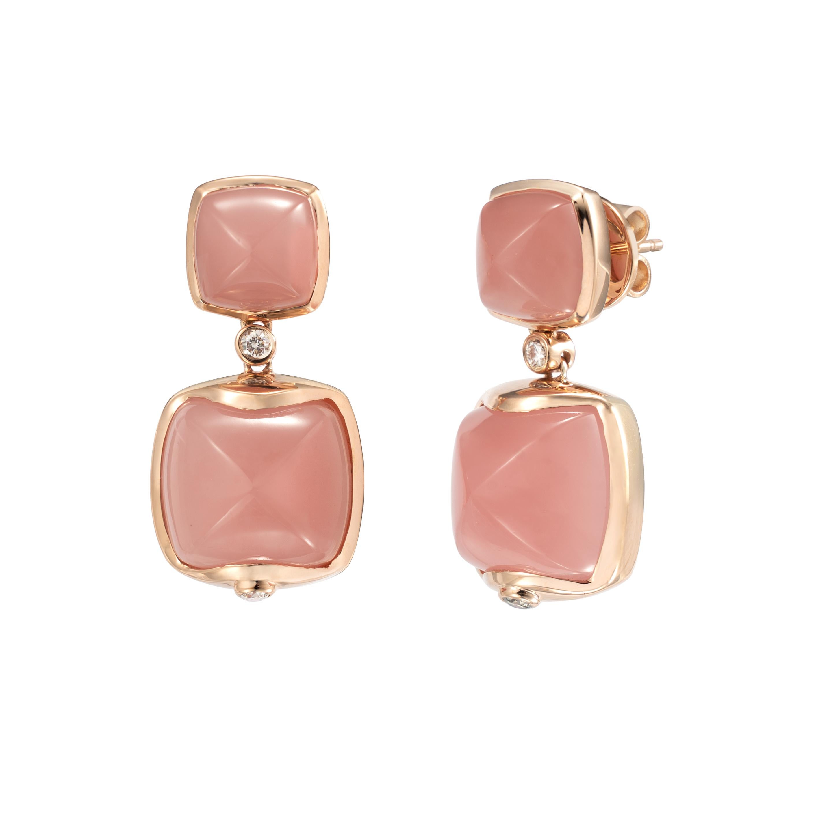 Sweet Sugarloaves! Light and easy to wear these earrings showcase beautiful sugarloaf gemstones accented with a gold frame and diamonds. These earrings are dainty yet have a great pop of color from the vibrant gems.

Guava Quartz Sugarloaf Earrings