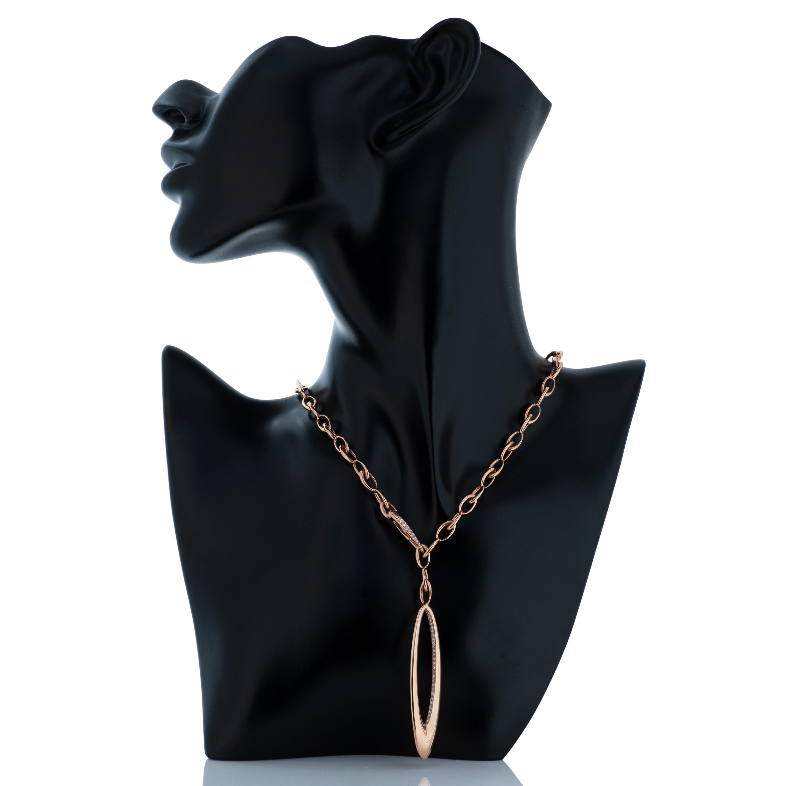 Gubelin 18 karat rose gold adjustable length chain necklace with diamond pendant and clasp.
The necklace contains approximately 0.70 carat of round diamonds with estimated G-H color and VS clarity.  
50.54 grams total.  
The necklace is adjustable