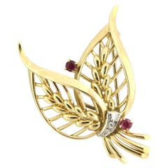 Gübelin Broche de oro bicolor de 18 quilates con rubí y diamante, circa 1990