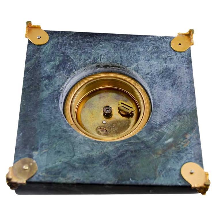 FACTORY / HOUSE: House of Gubelin
STYLE / REFERENCE: Art Deco Flat Table Clock 
METAL / MATERIAL: Stone and Gilt Brass
CIRCA / YEAR: 1930's
DIMENSIONS / SIZE:  Length 5