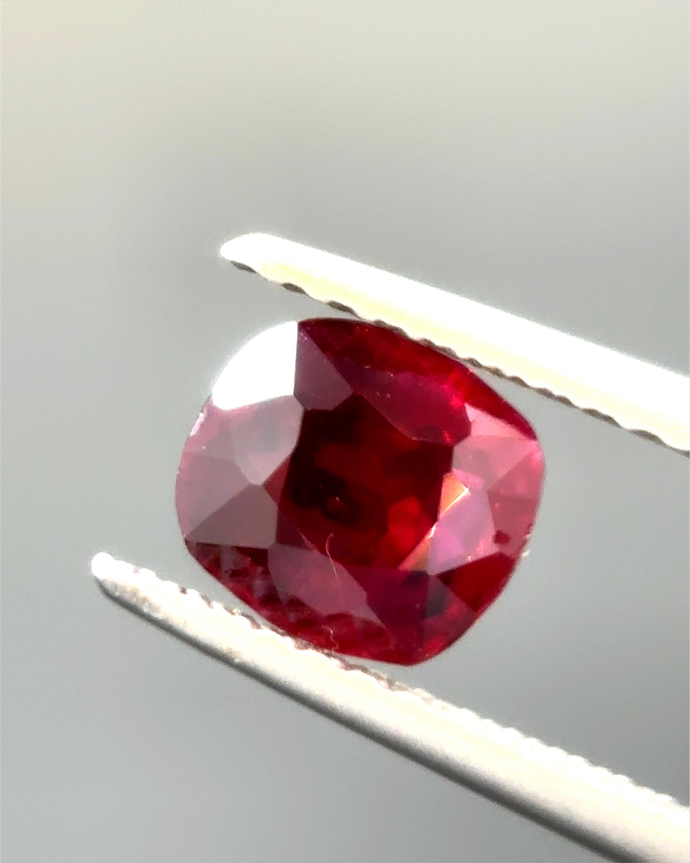 This exquisite 0.893 carat Burma no-heat vivid red ruby is a rare and valuable gemstone, distinguished by its exceptional color and provenance. Sourced directly from the renowned mines of Burma (Myanmar), this ruby exemplifies the finest quality