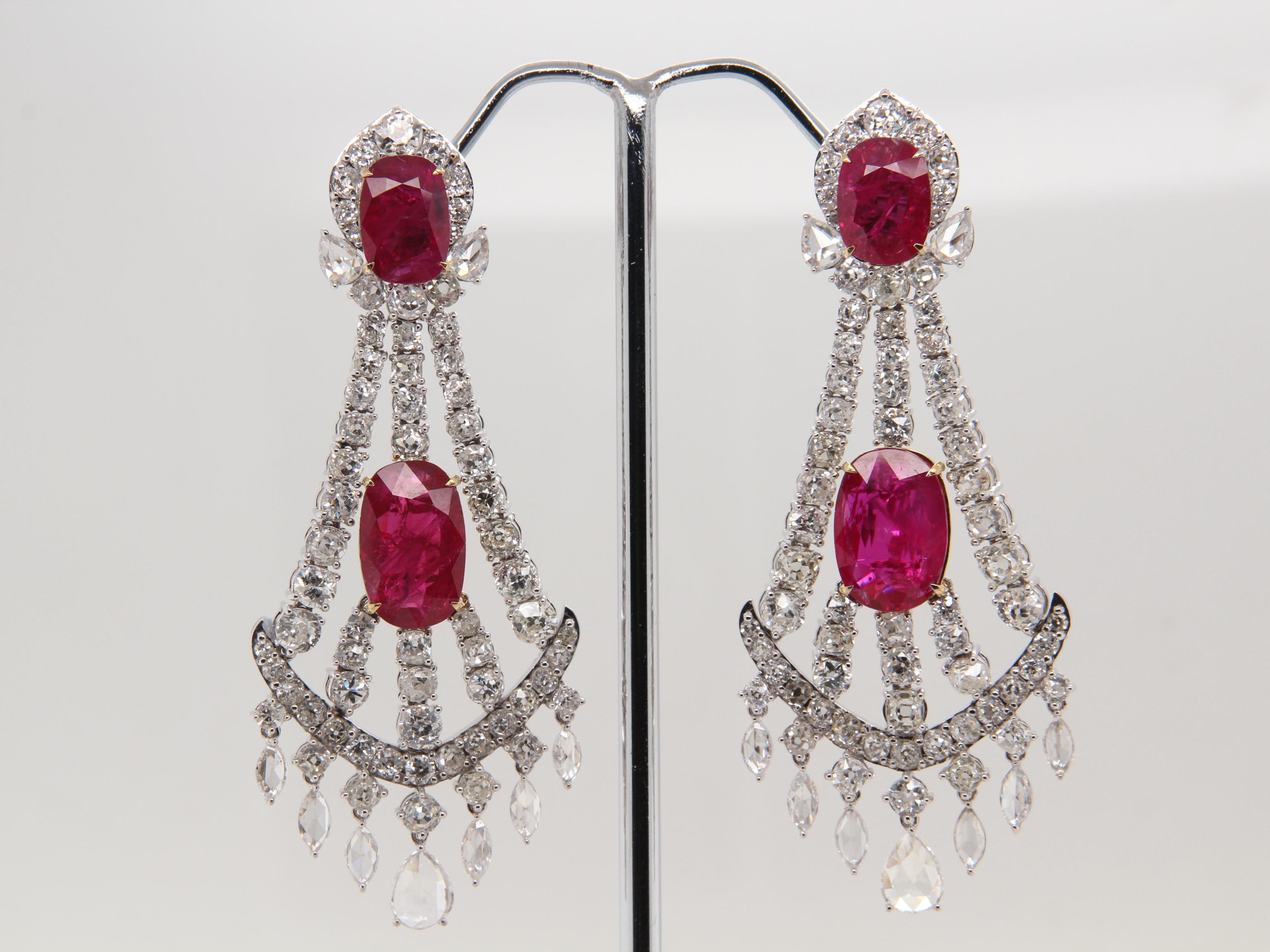 A gorgeous pair of chandelier earrings carefully crafted with rare unheated burmese rubies. The rubies weigh 10.54 carat and is certified by Gubelin Gem Lab as natural, no heat, and 'Red'. The total diamond weight is 10.21 carat and the total