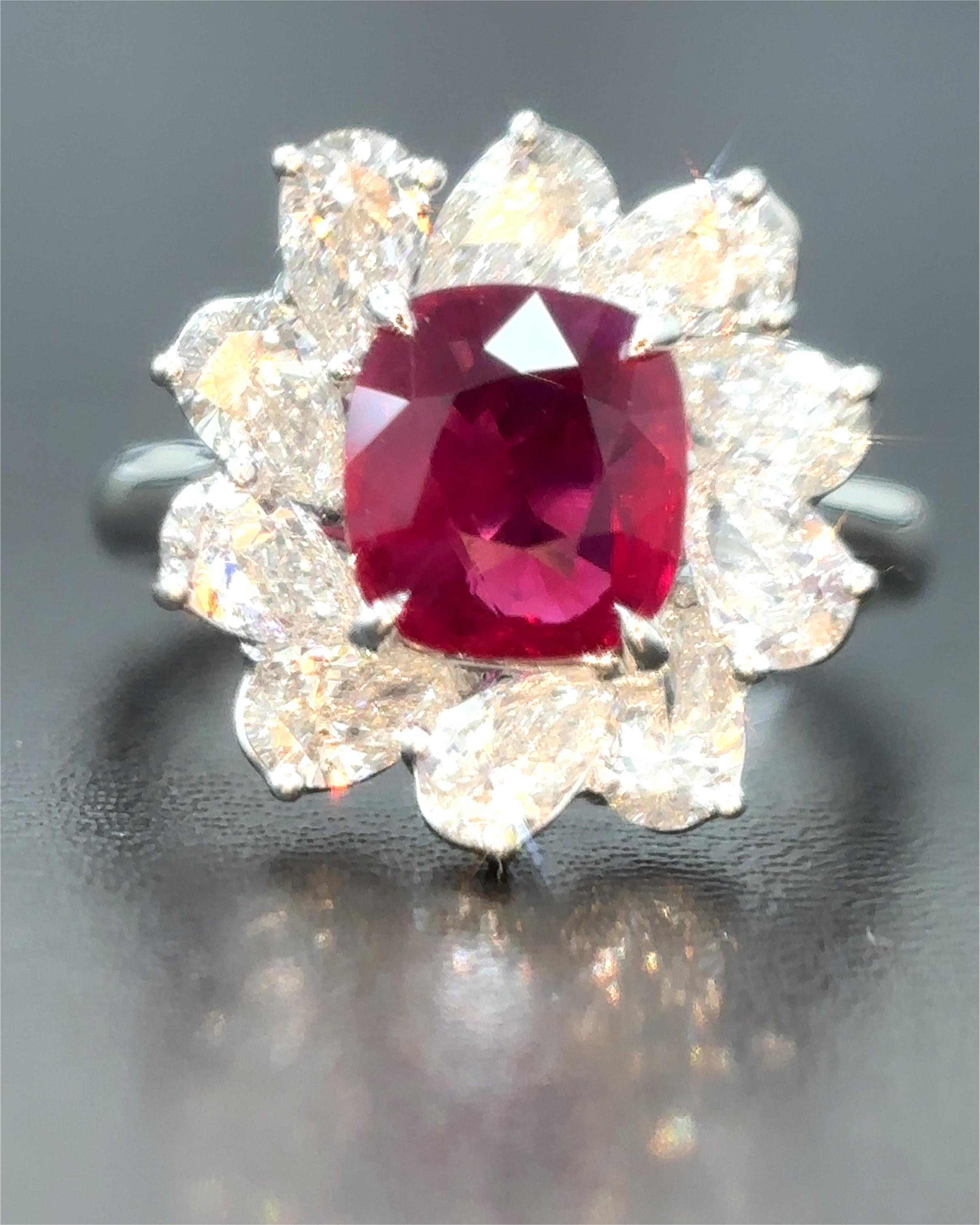 A beautiful creation, it features a rare 2.45 carat Burmese natural ruby, spared of any treatment whatsoever, surrounded by high quality natural white pear cut diamonds weighing 2 carat.

Certified by Gubelin Gem Lab, the ruby is fashioned as a