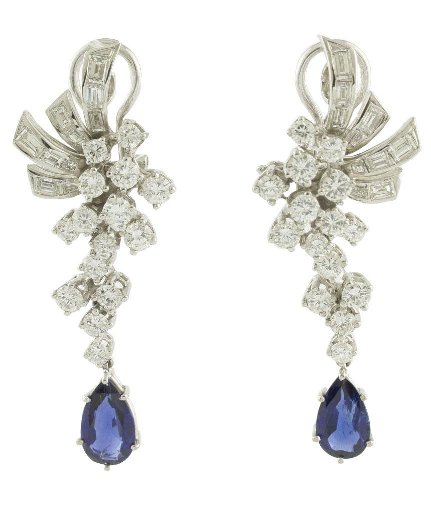 Fabulous earrings in 18K White gold structure mounted with special leave shape studded by white diamonds  (3.73 ct) and 2 amazing blue sapphires (1.48ct and 1.35 ct) drops certified by Gubelin Gem Lab as  Burma (Myanmar) No Indications of Heating