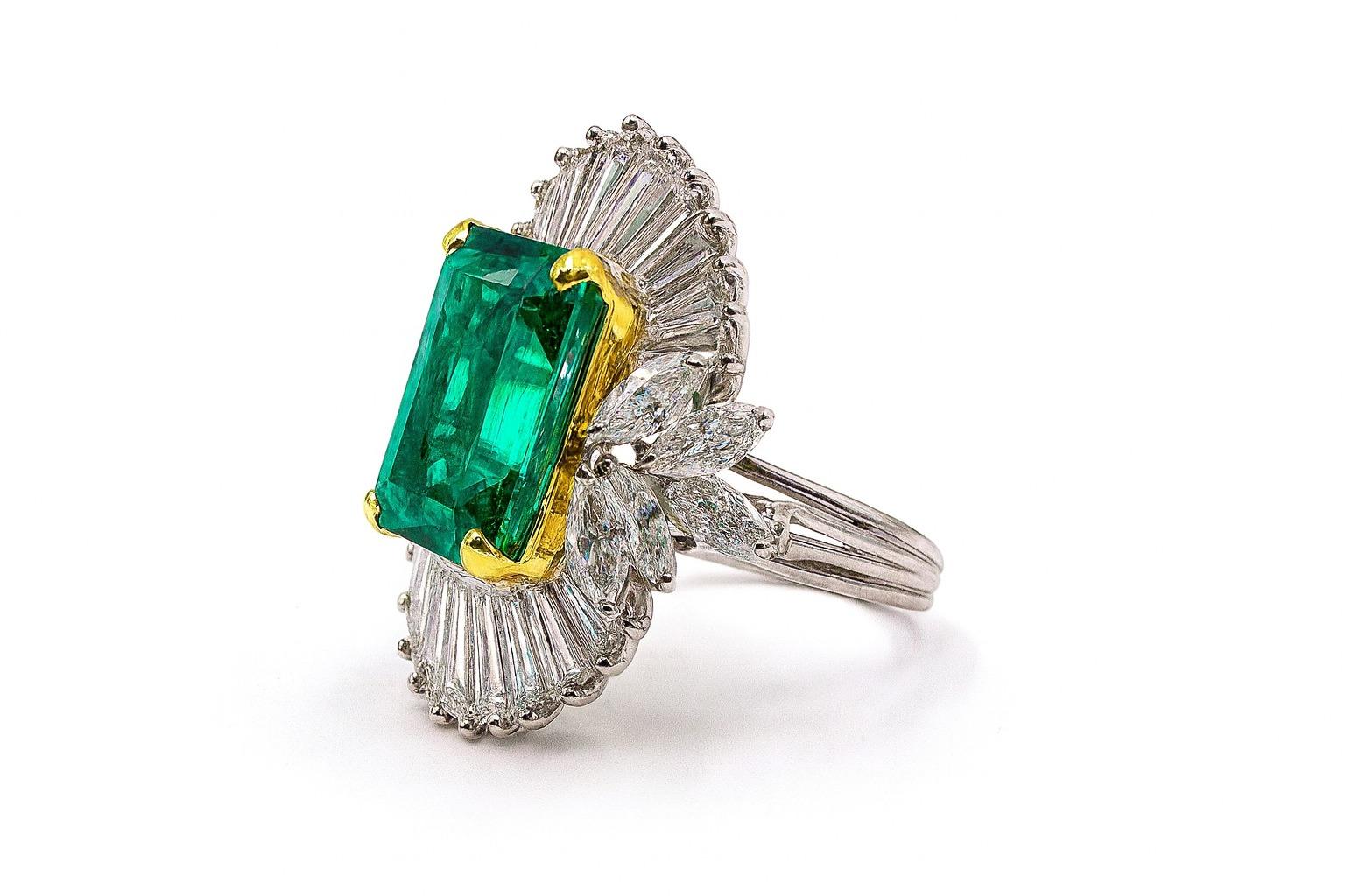 6.73 Carat Colombian Emerald Diamond Platinum Ring

Description

A striking platinum ring centering a 6.73 carat square step-cut Colombian emerald (minor enhancement), beautifully showcased within an undulating mount of tapered baguette-cut diamonds
