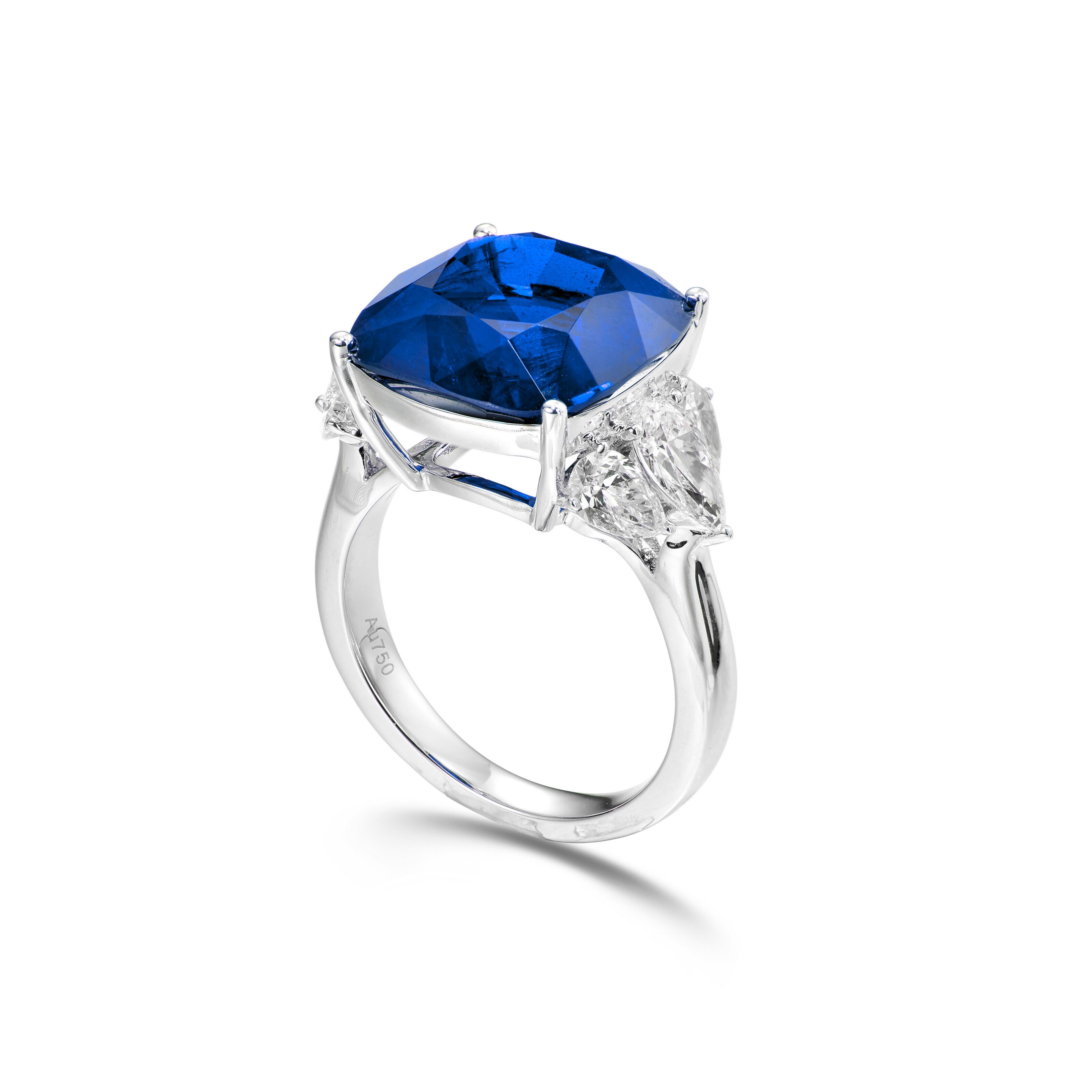 Centering a cushion-shaped sapphire, flanked by 9 cushion-shaped diamonds, decorated throughout with pear and marquise diamonds.
Size 6
Platinum
Accompanied by Gubelin and Grs report
