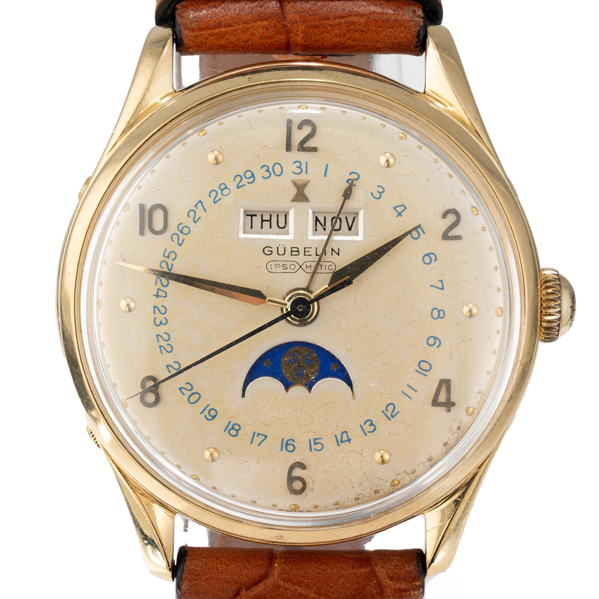 Rare Ipso Matic, self winding, Moon Phase Gubelin 1960's 18k gold watch. This timepiece not only showcases the phases of the moon but also displays the day and month, offering both style and functionality. Newer leather band. Normal wear  for the