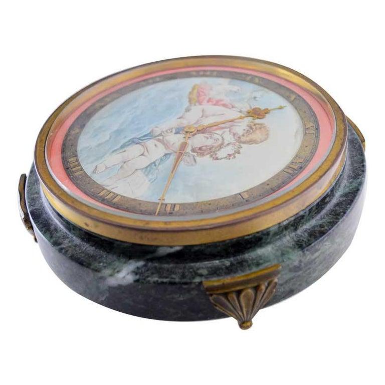 Milieu du XXe siècle Gubelin Stone and Metal Art Deco Table Clock with Cherubic Hand Made Dial 1930's en vente