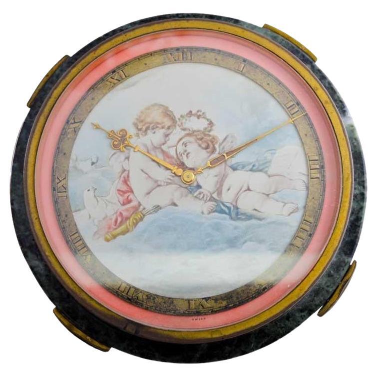 Gubelin Stone and Metal Art Deco Table Clock with Cherubic Hand Made Dial 1930's en vente