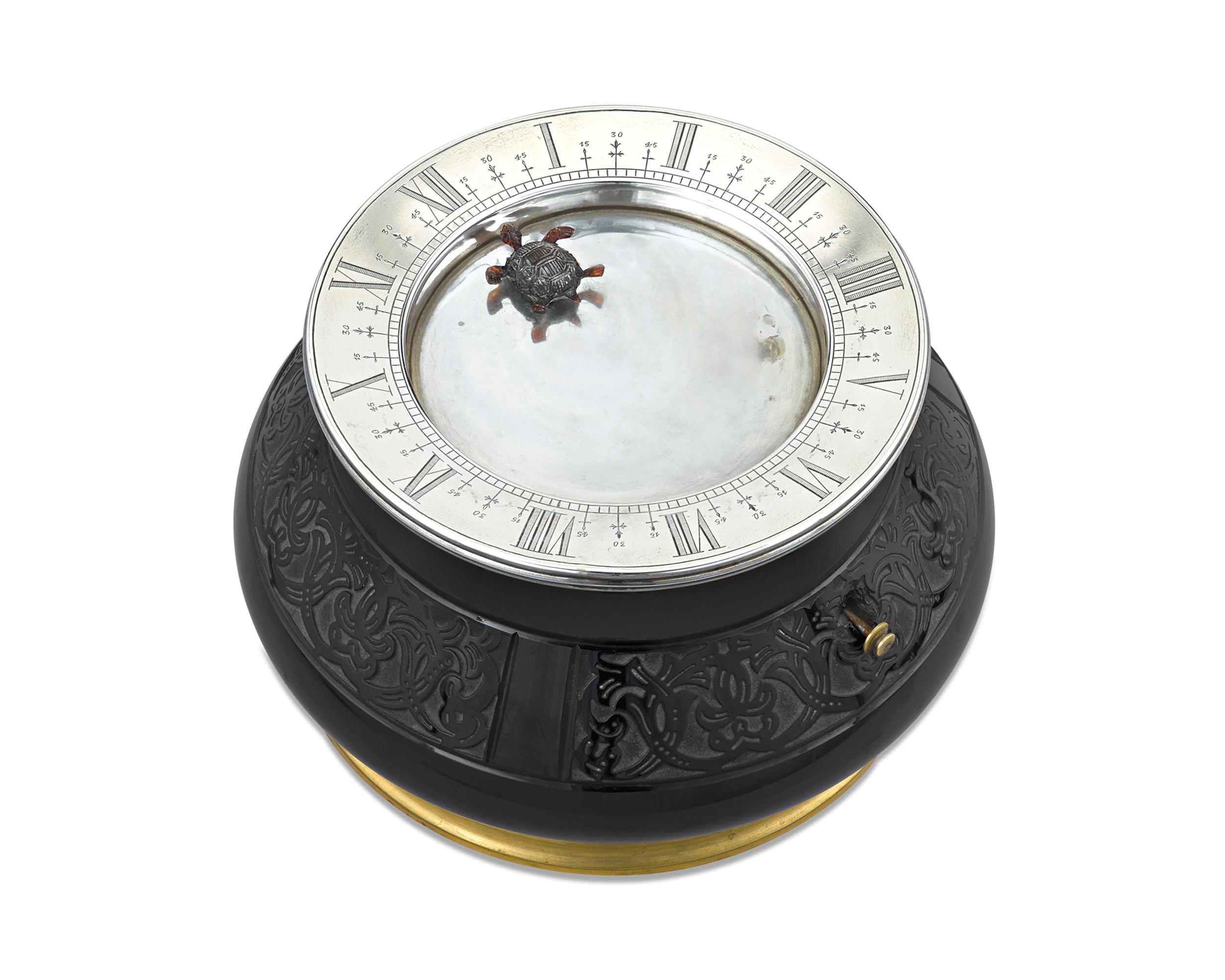 One of the rarest and most sought-after of the great mystery clocks, the Gübelin turtle mystery water clock is a true wonder of horology. This timepiece was created during the Art Deco era and features a charming turtle that, when the basin is