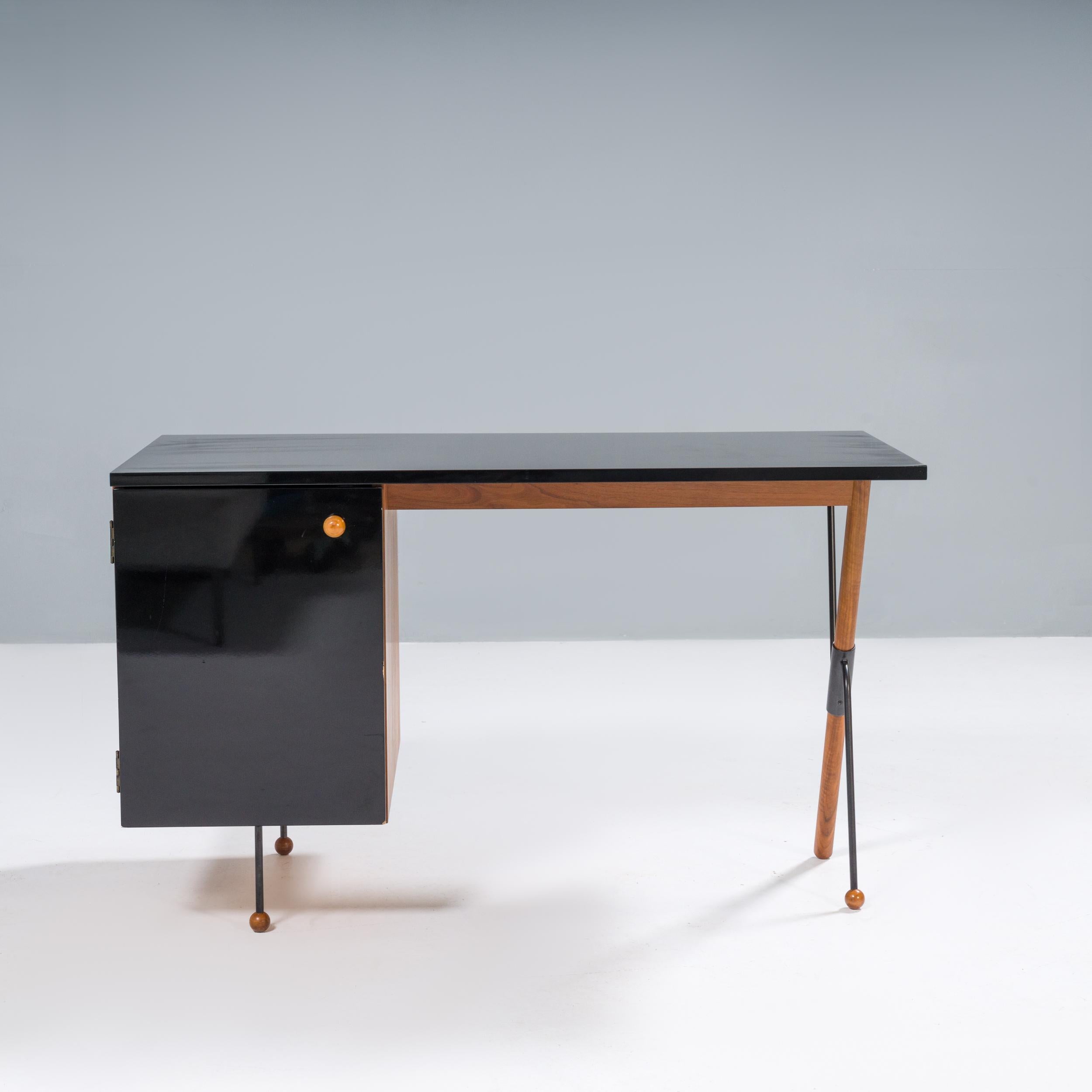 Originally designed by Greta M. Grossman in 1952, the desk was named the 62 for being a decade ahead of its time in its design aesthetic.

Now an iconic piece of mid-century furniture, the 62 Desk is a-symmetric in style and perfectly balances the