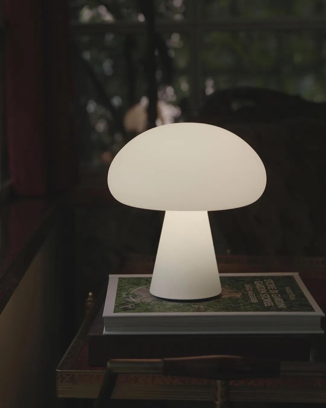 With a frosted, mouth-blown glass shade, as used for Curry’s original lamps, and integrated dimmable-LED light source, the rechargeable lamp can easily be moved between inside and out. With a complete charge in four and a half hours, providing up to