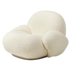 Gubi Pacha Swivel Lounge Chair with armrest by Pierre Paulin