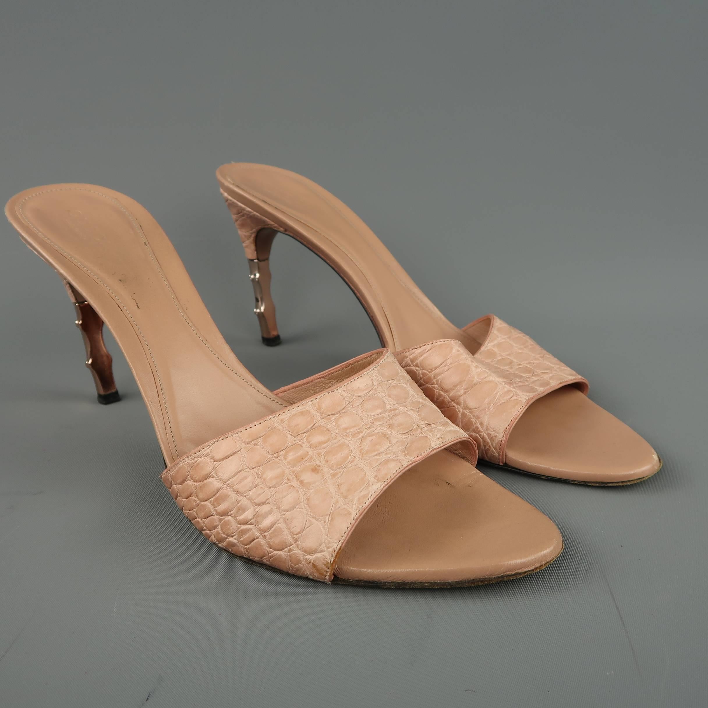 GUCCI mule sandals come in a dusty rose pink alligator textured leather with a half covered, rose gold tone metal bamboo heel. Wear throughout.As is. Made in Italy.
 
Fair Pre-Owned Condition.
Marked: 10 B
 
Heel: 4 in.