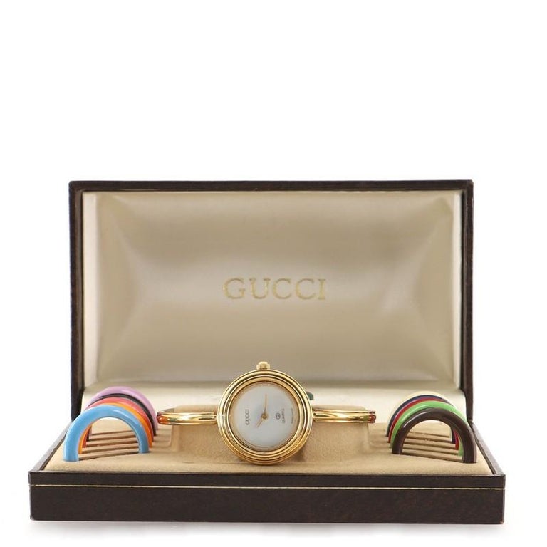 Gucci 1100 Interchangeable Bezel Bangle Quartz Watch Plated Metal with  Plastic at 1stDibs | gucci 1100 series watch, gucci bracelet watch, gucci  bangle watch