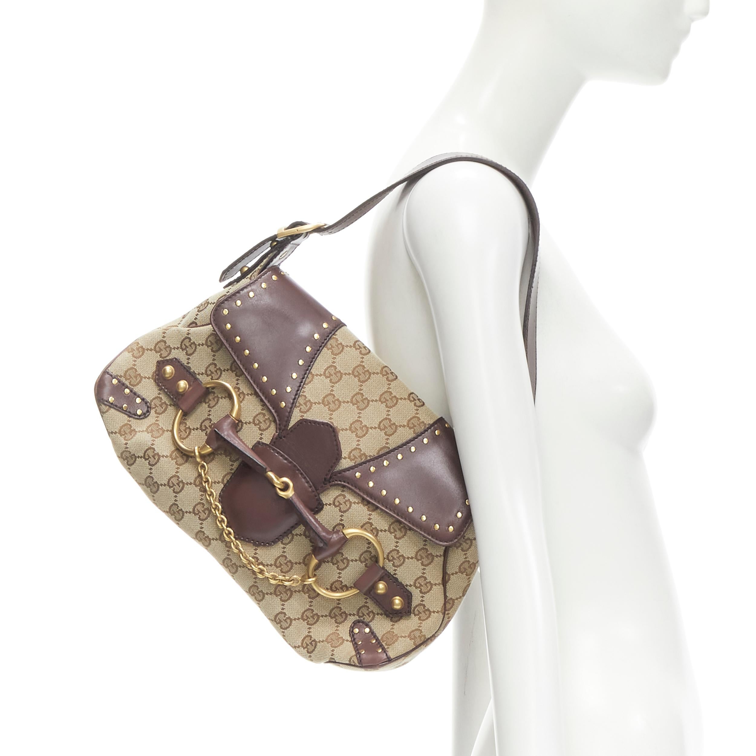 GUCCI 114915 burgundy leather GG monogram gold Horsebit chain flap shoulder bag
Brand: Gucci
Designer: Tom Ford
Model: 114915
Material: Canvas
Color: Brown
Pattern: Logomania
Extra Detail: Brown GG mongoram canvas upper with burgundy leather trim.