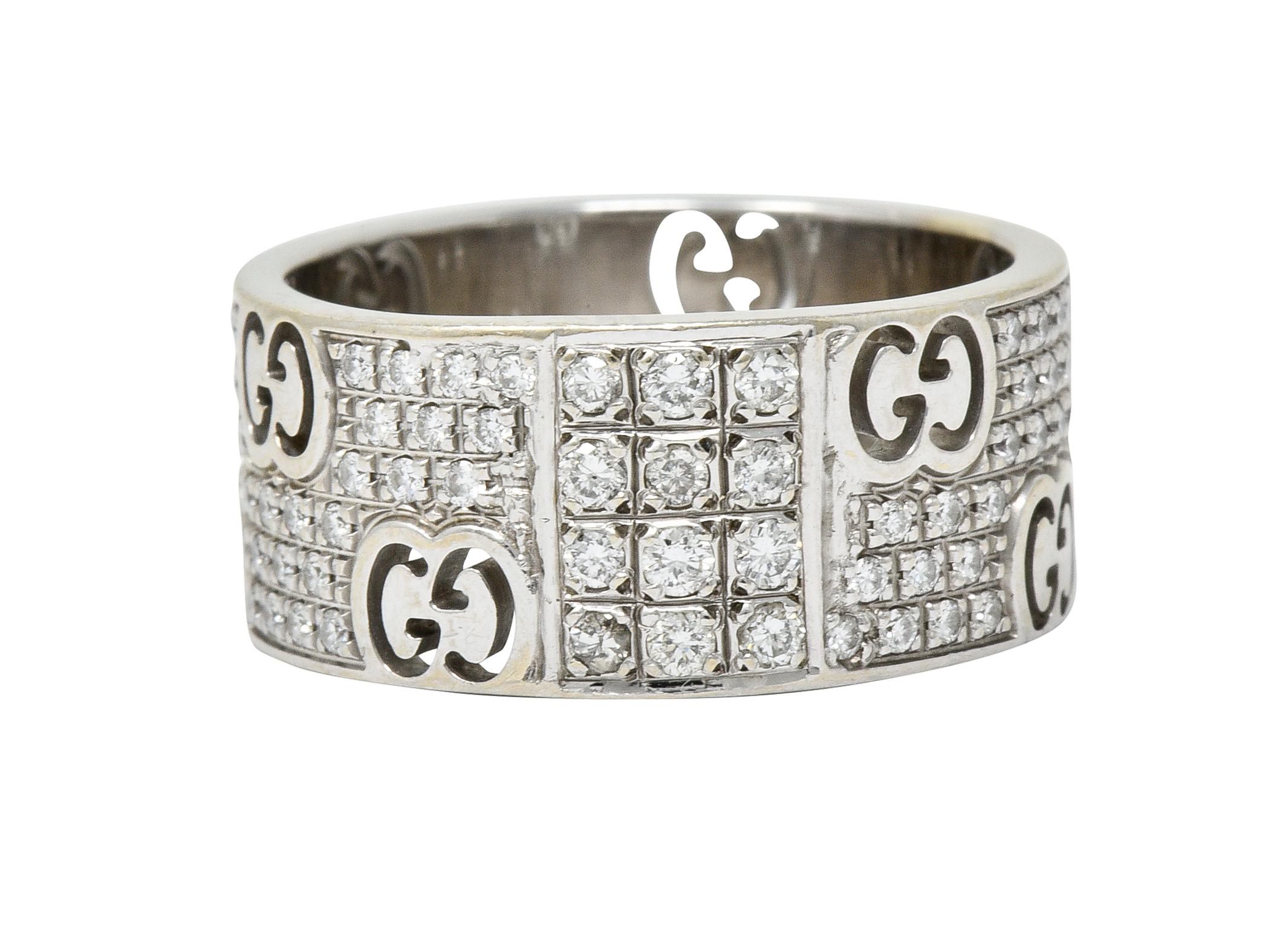 Wide band ring is pierced throughout by the iconic Gucci 'GG'

And centers a rectangular station bead set by three rows of round brilliant cut diamonds

Remainder of ring is pavè set throughout by additional round brilliant cut diamonds

Total