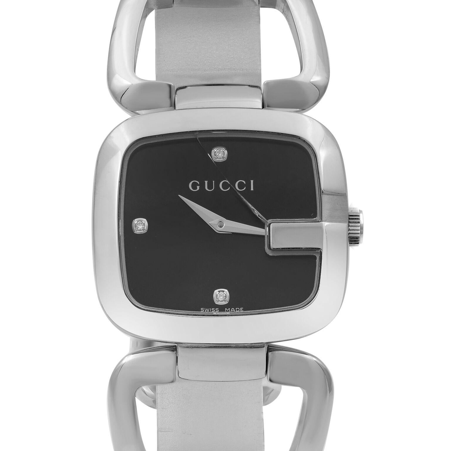 This pre-owned Gucci  YA125406 is a beautiful Ladie's timepiece that is powered by quartz (battery) movement which is cased in a stainless steel case. It has a round shape face, no features dial and has hand diamonds style markers. It is completed