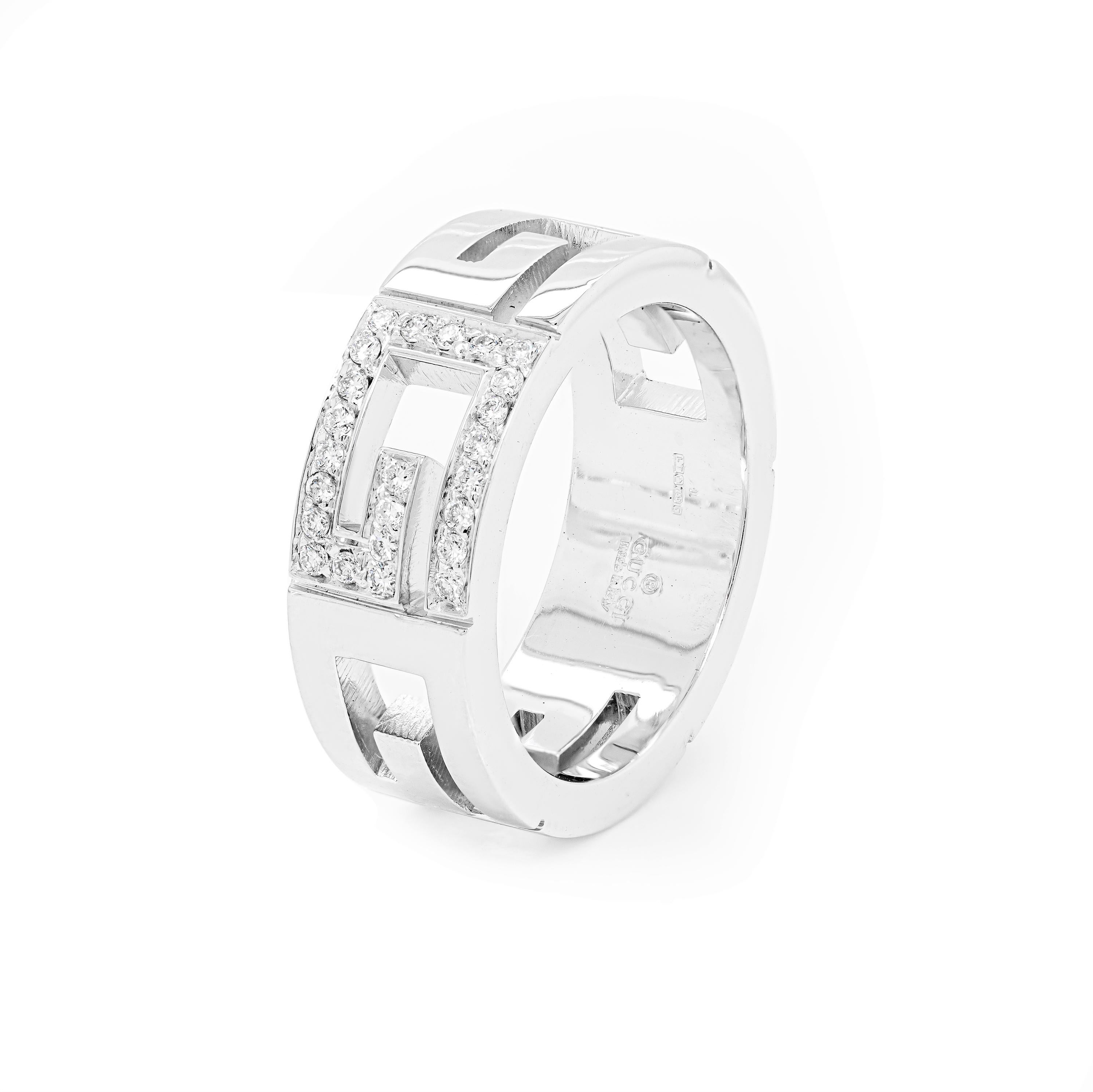 This beautiful ring from the luxury fashion house Gucci is beautifully designed as an open work piece showcasing the iconic 'G' logo cut-out multiple times throughout the 18 carat white gold band. The central 'G' is decorated with 24 high quality