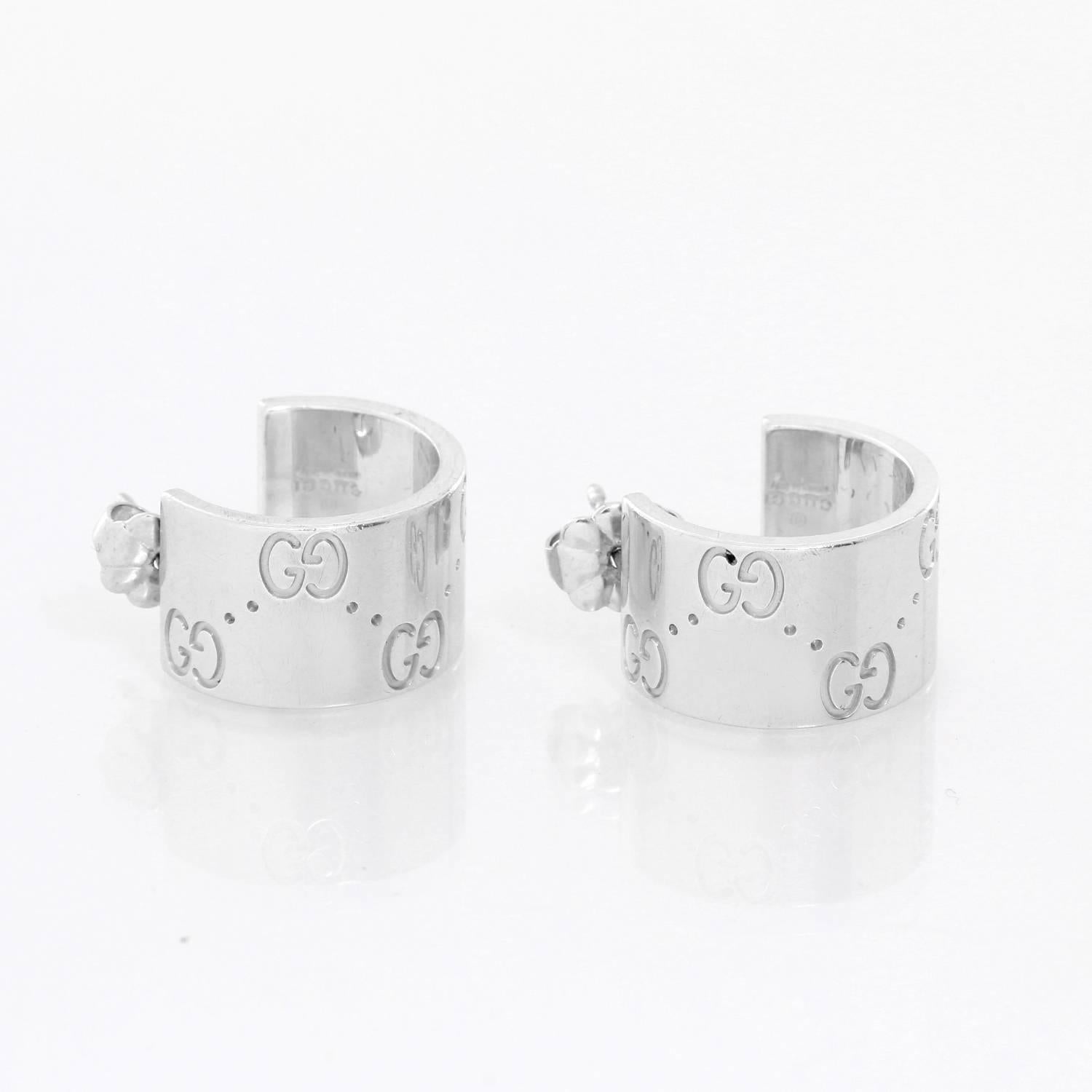 Gucci 18K White Gold Small Hoop Earrings - . Classy, simple design with  Gucci monogram hoops. 18K White gold. Hallmarked; Marker's mark, 750. . 1/2 inch in diameter. Total weight 9.9 grams.