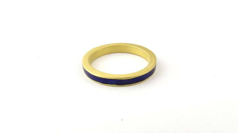 Vintage Gucci 18 Karat Yellow Gold and Blue Enamel Ring Size 4.5.

This elegant band is beautifully crafted in 18K yellow gold and blue enamel. 
Width: 2 mm.

Ring Size: 4.5

Weight: 1.9 dwt. / 3.1 gr.

Stamped: K18

Hallmark: Gucci Italy

Very good