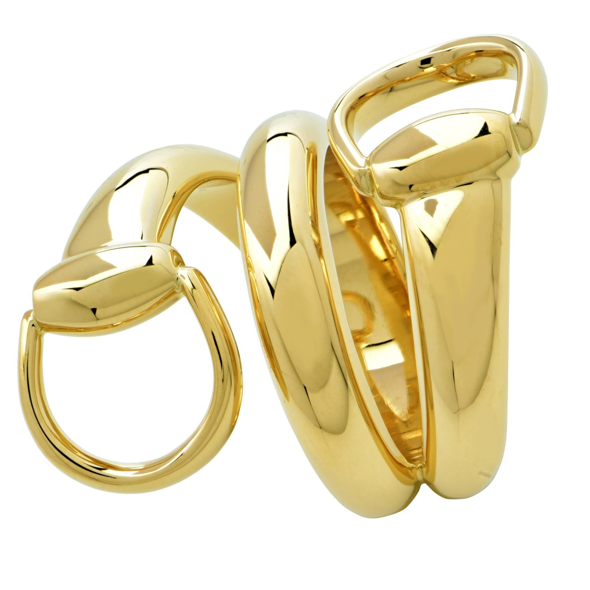 Gorgeous Gucci Horsebit ring crafted in 18K yellow gold, measuring 1.2” and tapering to .25 of an inch. This signature equestrian style ring is a size 6.5. 

Our pieces are all accompanied by an appraisal performed by one of our in-house GIA