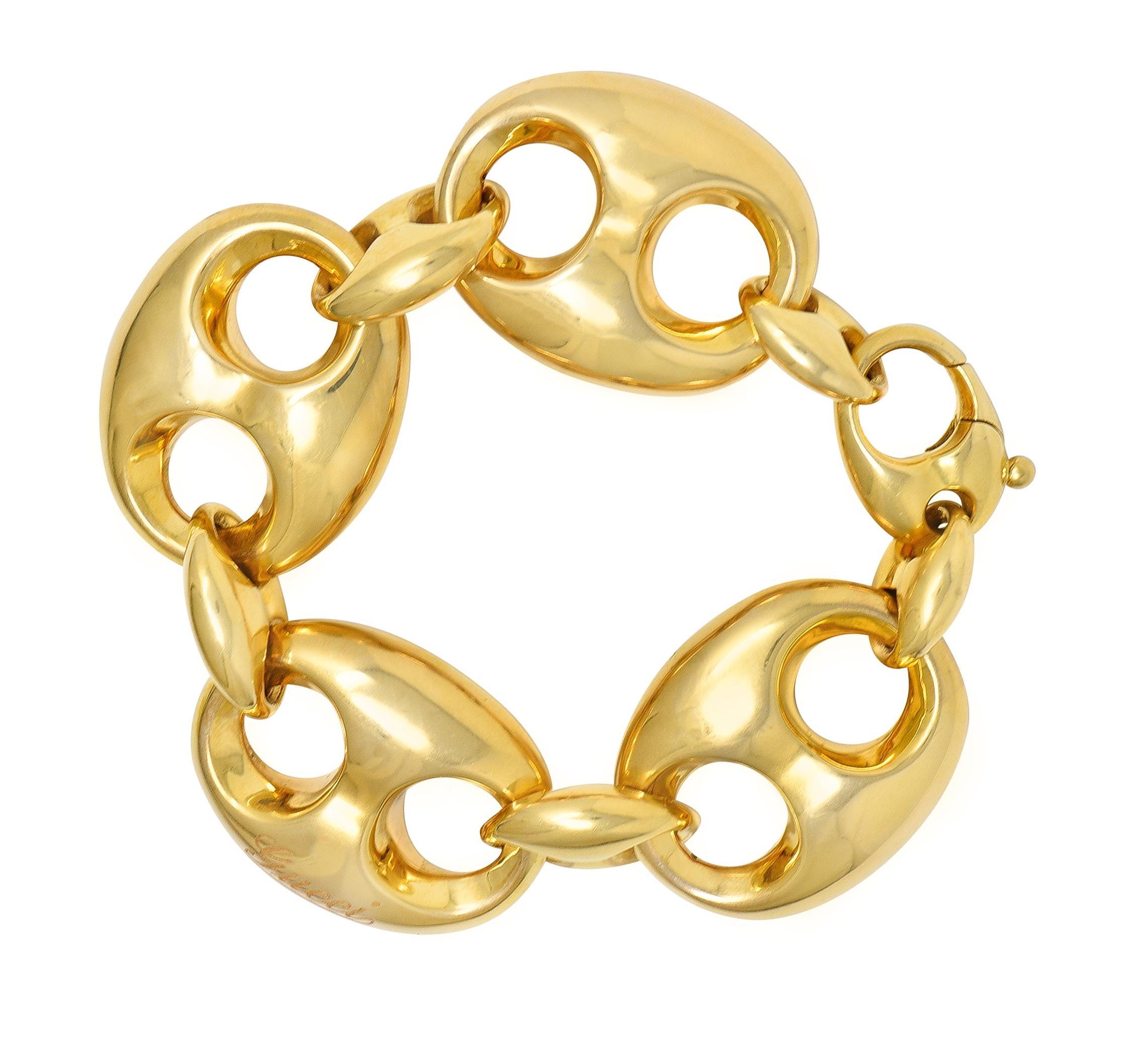 Designed as a stylized link bracelet with alternating large and small mariner links 
Puffy in style with high polish finish
Completed by stylized lobster clasp closure
Stamped with Italian assay marks for 18 karat gold
Numbered and fully signed for