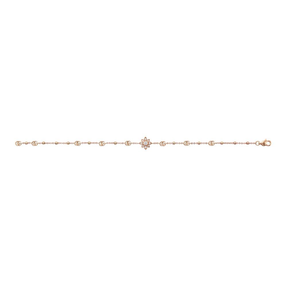 Feminine and fashionable, this Gucci Flora collection station bracelet is an elegant addition to a look.

Crafted with 18k rose gold, the bracelet features a diamond flower along with the classic Interlocking G icon.

Includes a clasp closure to fit