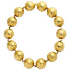 Collana Gucci in oro 18 carati con sfere d'oro di grandi dimensioni e finitura in alligatore