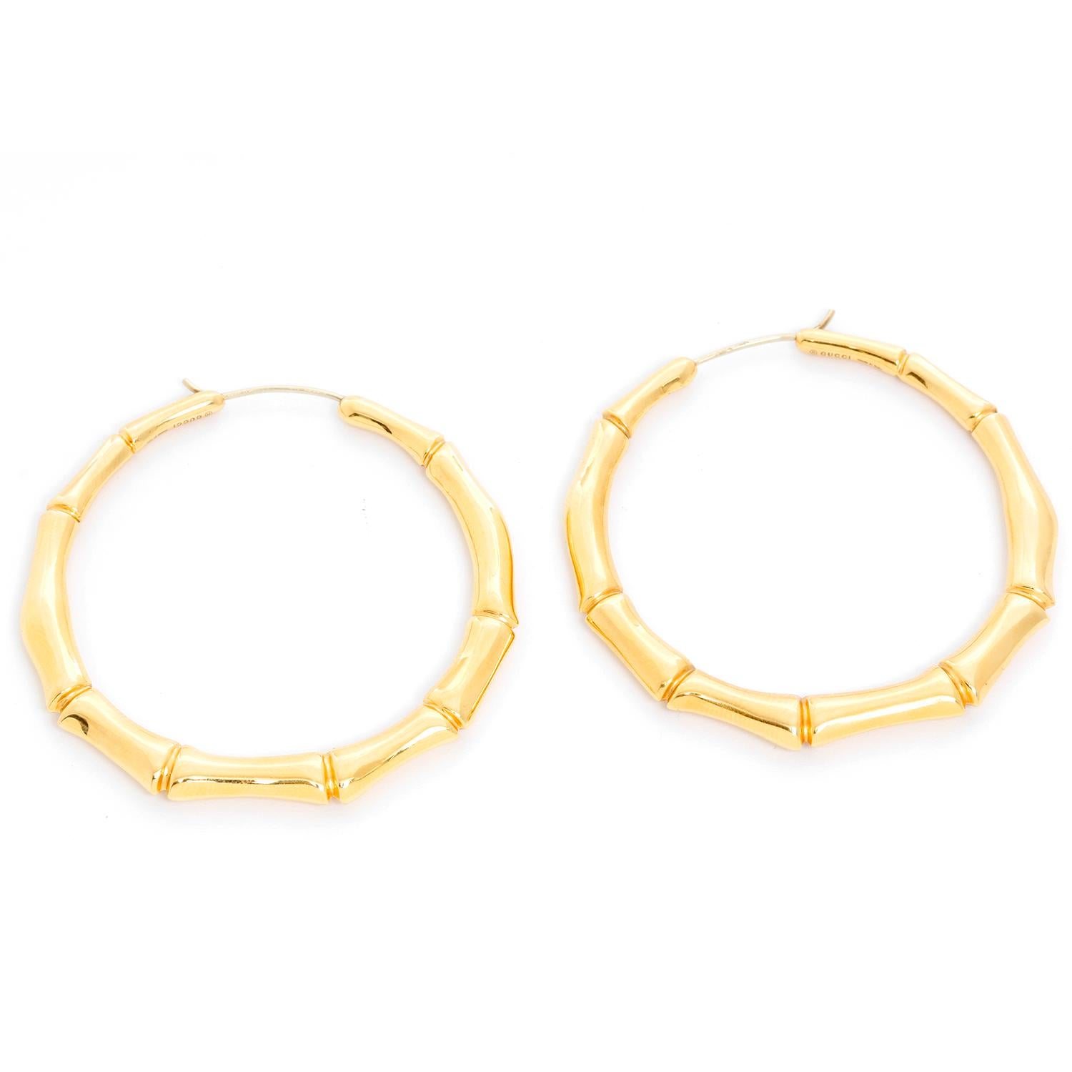 Gucci 18K Yellow Gold Bamboo Hoop Earrings  - The graceful form of the bamboo plant has been iconically interpreted by the House of Gucci in these 18K yellow gold hoops. Pre-owned with Gucci box. Length 2.2 inches. Weight 18 grams. 