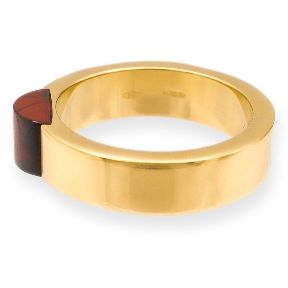 Gucci band ring finely crafted in Italy and made in 18 karat yellow gold featuring a domed cabochon garnet center inside a 5 mm band. Fully hallmarked with logo and metal content.

Ring Specifications
Brand: GUCCI
Style: Band
Hallmarks: GUCCI Made