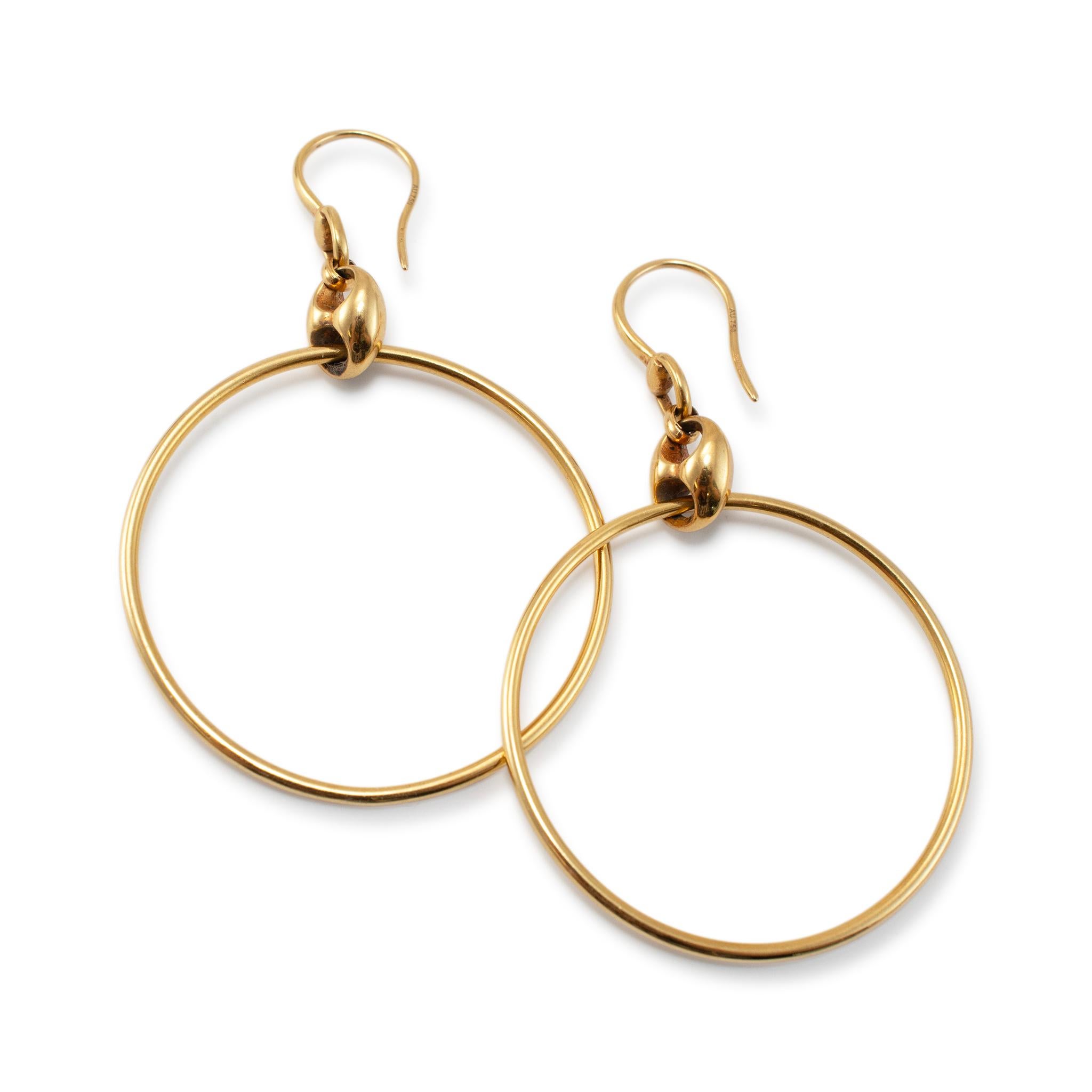 Brand: Gucci 

Gender: Ladies 

Metal Type: 18K Yellow Gold

Length: 2.38 inches

Width: 8.00 mm

Diameter: 1.50 inches 

Weight: 6.09 grams 

One pair of ladies 18K yellow gold hoop earrings with french backs. The metal was tested and determined to