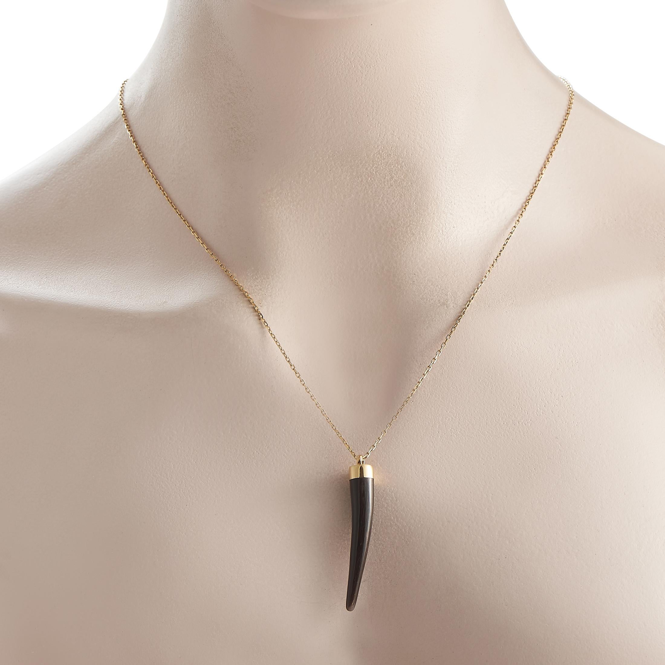A luxurious yet offbeat luck amulet from the high-fashion Italian house, Gucci. This necklace features a black onyx horn pendant suspending from an 18K yellow gold chain. The pendant measures 1.5 by 0.25 while the necklace chain measures 22 inches