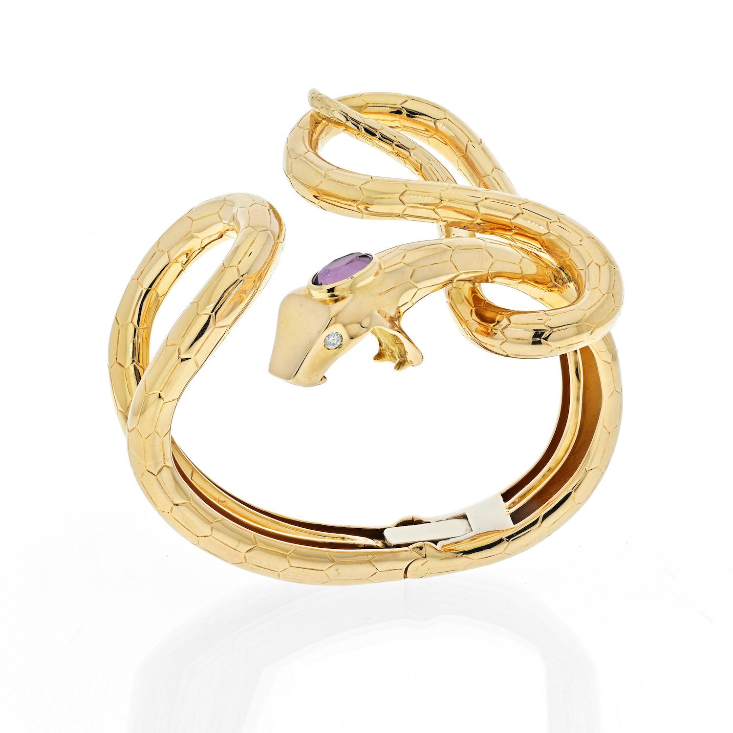 This is a fabolous find: hefty Snake Hinged Cuff Bracelet by Gucci. The articulated arm cuff is designed as a snake set with amethyst atop of it's head and the eyes are set with round cut diamonds. This chic and contemporary Gucci bracelet can be