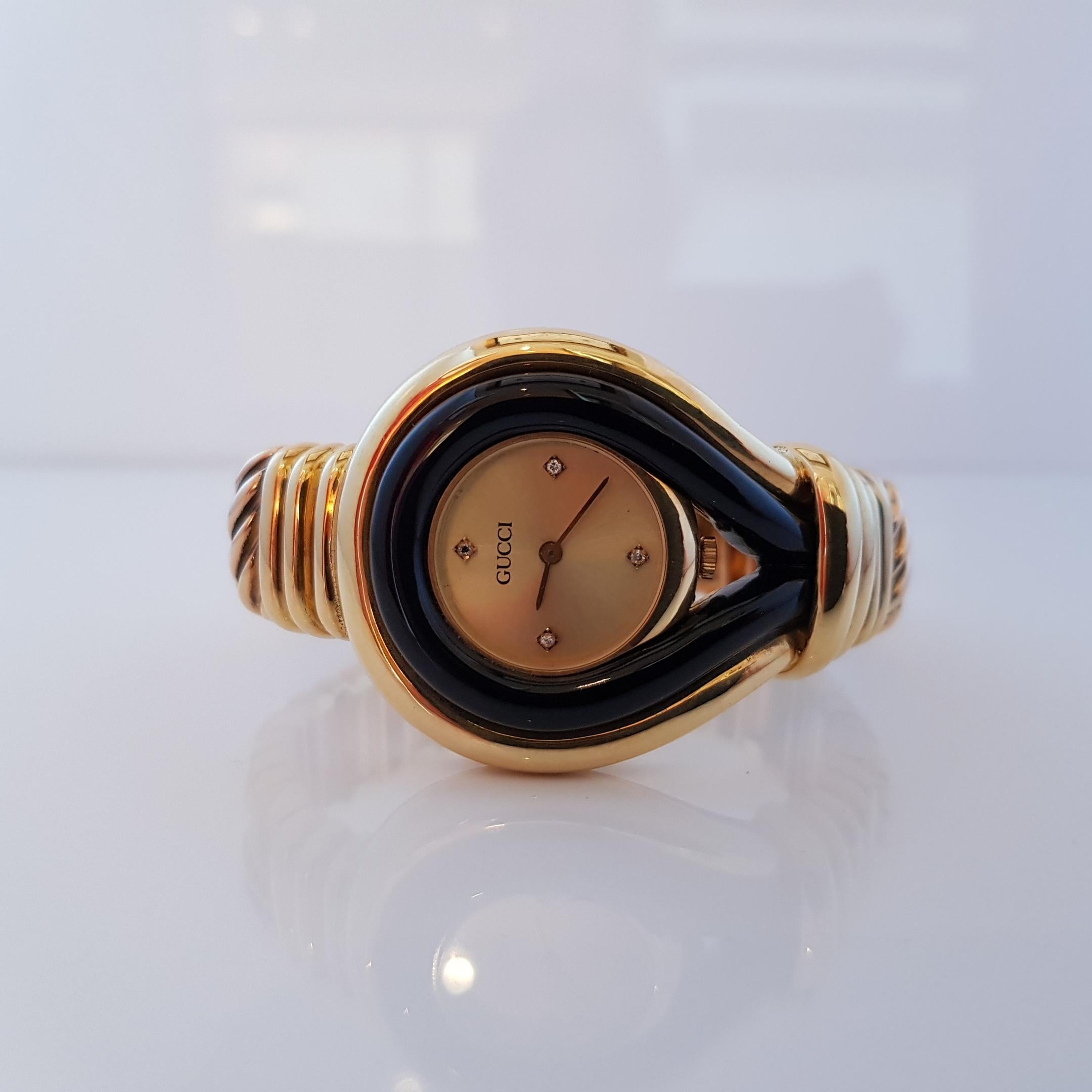 Contemporary Gucci 18 Karat Gold, Diamonds and Onyx Watch For Sale