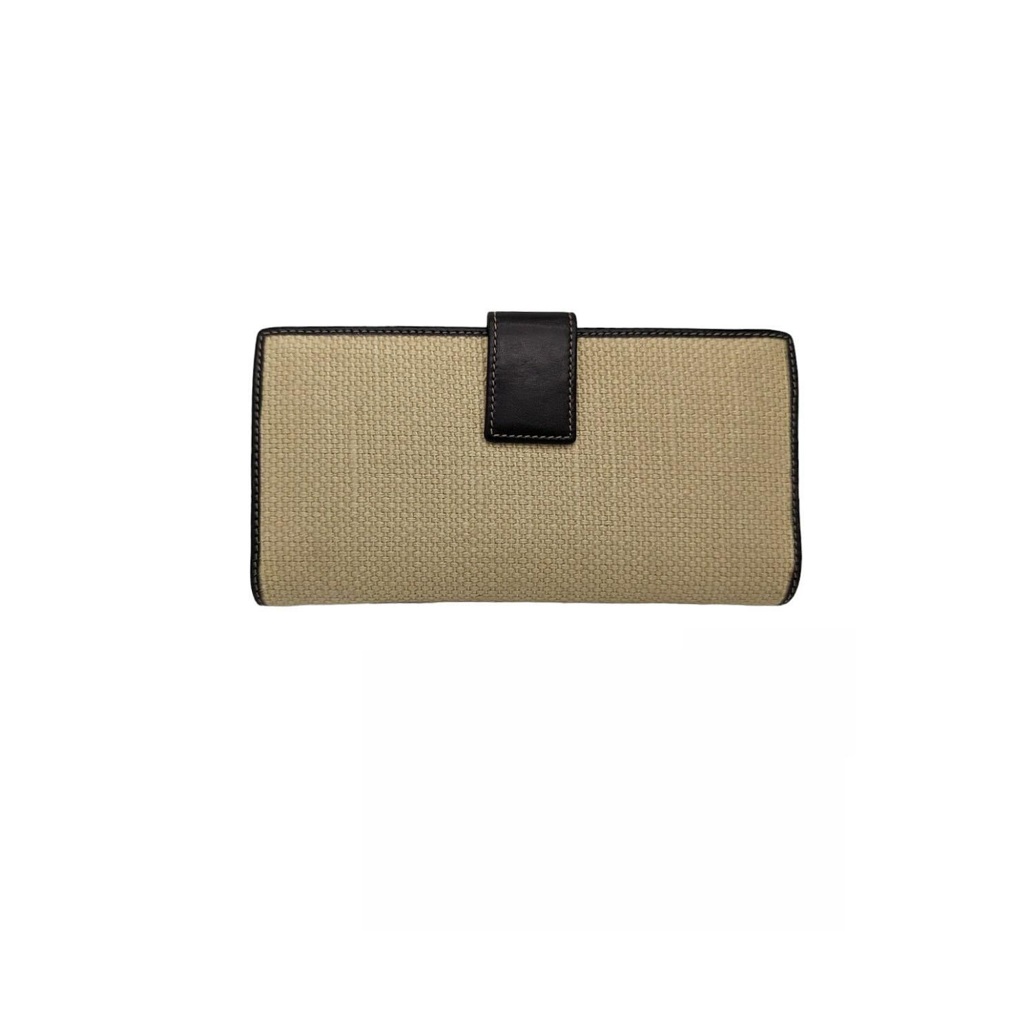 This Gucci Woven Linen Horsebit Continental Flap Wallet is a chic way to organize your essentials like your bills, credit cards and plenty of coins. It features durable brown leather with gold-tone horsebit details and a flap closure.

Designer: